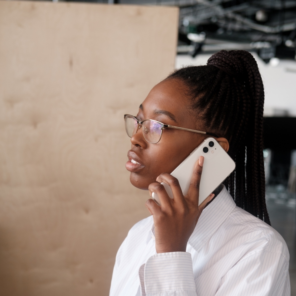 Image 1 – Cloud phone systems Woman using a cloud phone system on her mobile device